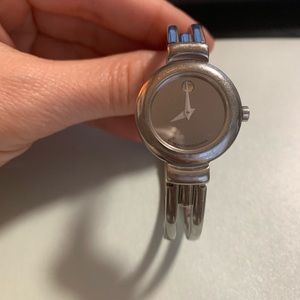 Woman’s Movado silver watch with glass face